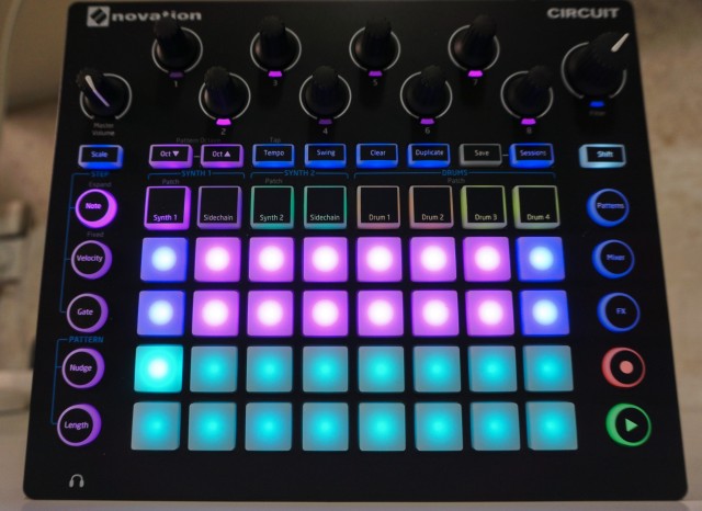a Novation Circuit device. Glowy buttons and some knobs.